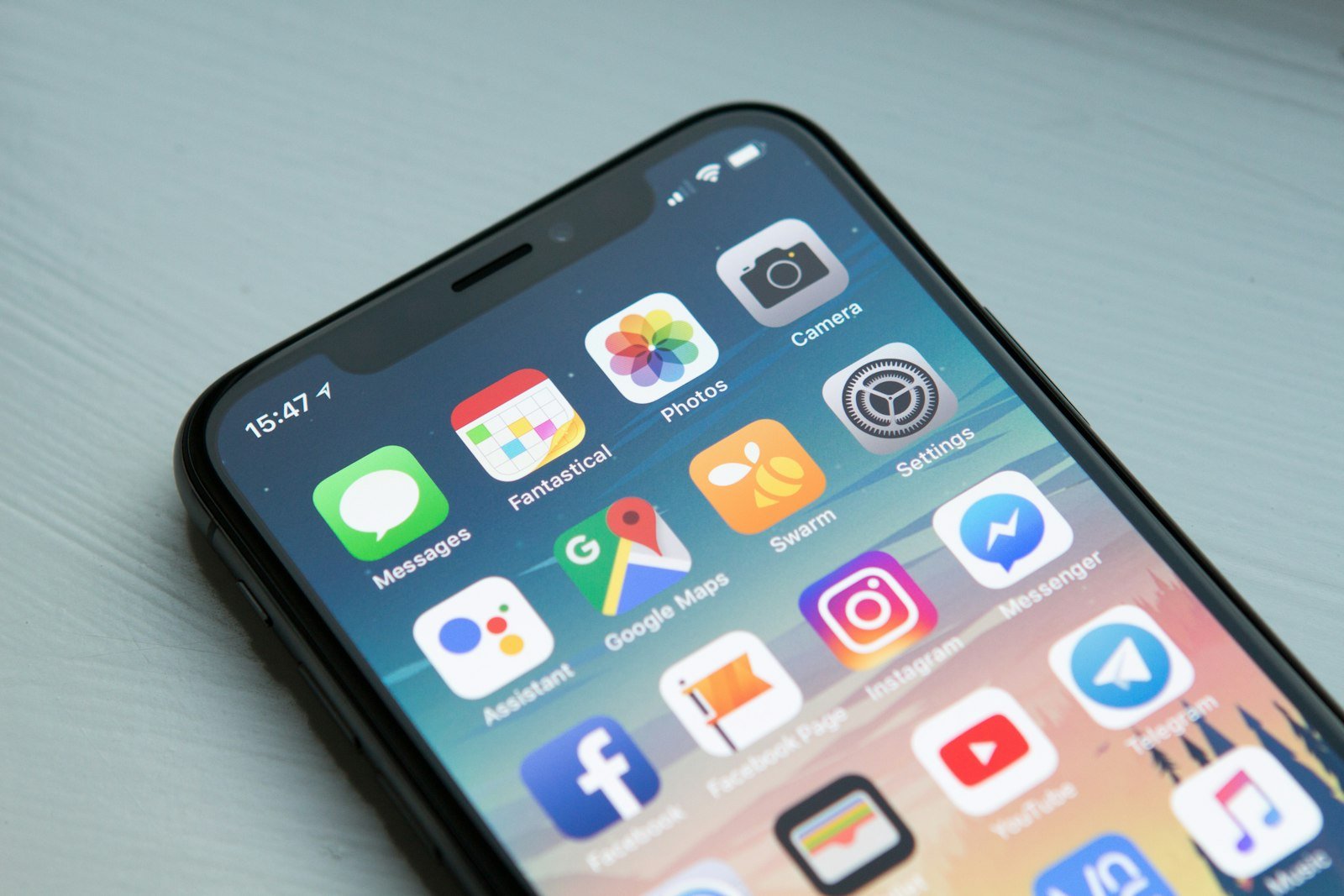 A smartphone home screen showing social media app icons
